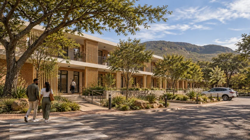 The office frontage. The street edge brings together shaded entrances, planted parking and pedestrian access.